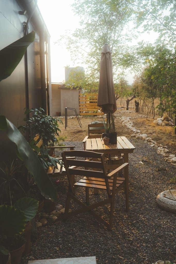 Backyard seating area with wooden outdoor furniture